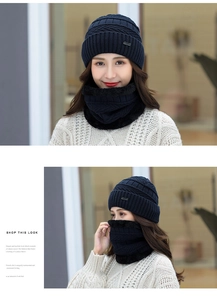 Detail of dark blue knitted hat and neck scarf set with fleece lining for winter warmth