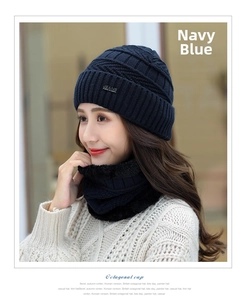 Detail of navy blue winter knit hat with fleece neck gaiter and JEANS label