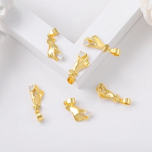 Artistic layout of six gold hand-holding diamond pendants for DIY jewelry making
