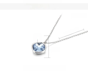 Detail view of 15mm light blue square glass pendant on a 450mm stainless steel chain