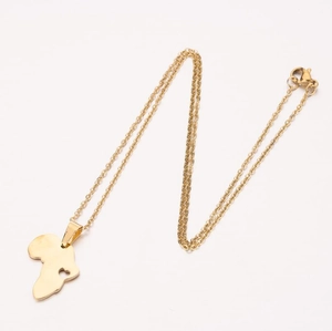Golden stainless steel Africa map necklace with hollow heart pendant on white background