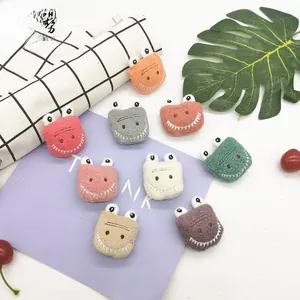 Detail of colorful plush cartoon crocodile patches for DIY clothing and bag accessories