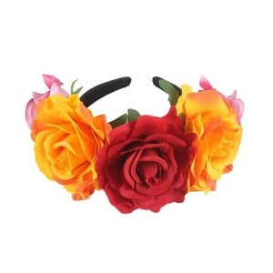 Close-up of vibrant red, orange and pink fabric roses on a Halloween party headband