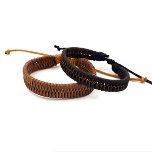 Handmade braided leather cord bracelets in black and brown with adjustable slide knot