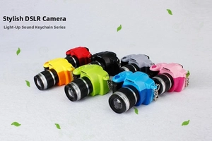 Detailed view of colorful mini SLR camera keychains with LED light and sound functions