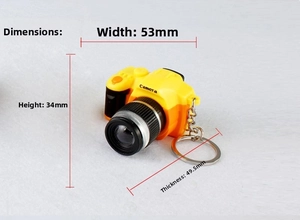 Detail view of yellow miniature camera keychain showing exact dimensions 53x34x49.5mm
