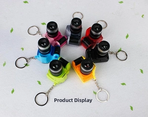 Detailed top view of colorful camera keychains in seven vibrant colors with metal rings