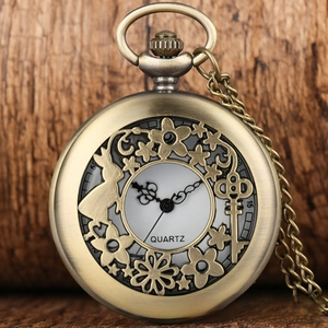 Macro view of vintage bronze quartz pocket watch with Alice Wonderland hollow carving