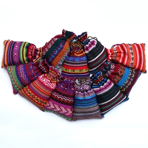 Ethnic style drawstring gift bags with colorful woven stripes in a fan-shaped arrangement