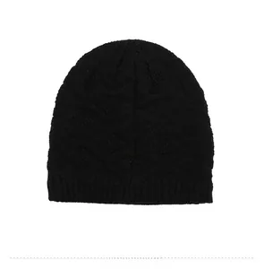 Detailed back view of a black cable-knit beanie featuring thick textured wool pattern