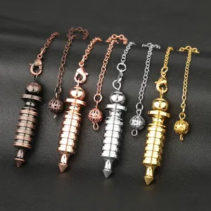 Spiral metal dowsing pendulums in bronze, rose gold, silver, and gold on black leather
