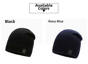 Detail view of knitted beanie hats in black and navy with leather logo patch