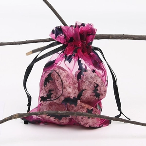 Detail of rose red Halloween organza gift bag with black bat and moon foil prints