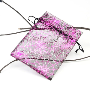 Pink sheer organza gift bag with spider web pattern for Halloween candy packaging