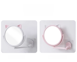 Detail of wall-mounted cat ear makeup mirrors showing foldable arm and adhesive base