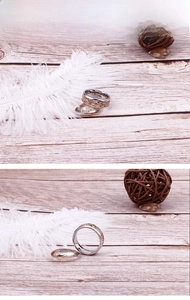 Macro detail of silver and rose gold stainless steel ring with vine patterns on wood