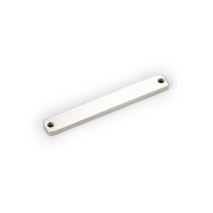 Close-up of polished silver stainless steel rectangular connector with double holes for DIY