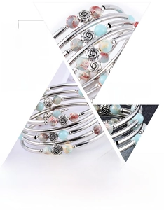 Macro detail of multi-layer turquoise bead bracelet with eco-friendly silver-plated tubes