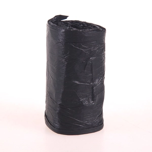 Thickened black plastic roll of drawstring kitchen trash bags on white background