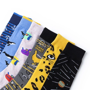 Flat lay showing variety of colorful patterned cotton mid-calf socks with playful designs