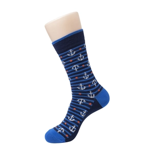 Detail view of cotton crew socks featuring nautical anchor patterns and navy blue stripes