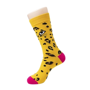 Detail of yellow leopard print knit socks with contrasting pink toe and heel segments