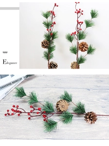 Close-up of pine branches with red berries and pinecones for Christmas decor