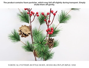 Close-up of Christmas branch with pine needles, red berries, and natural pinecones