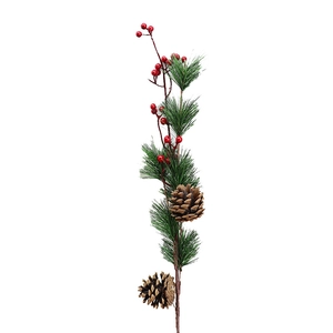 Christmas tree branch with red berries, green pine needles and natural pine cones