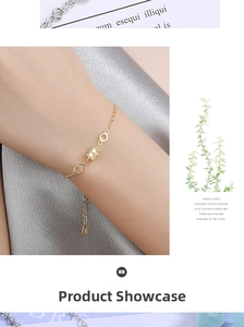 Detailed view of an adjustable gold S925 sterling silver bracelet on a wrist