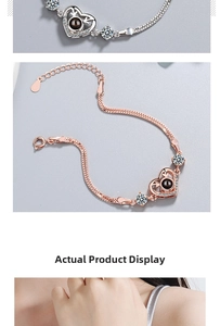 Macro detail of heart projection bracelet in silver and rose gold with zircon stones