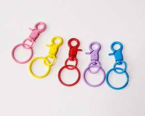 Set of colorful metal lobster claw clasps with matching split rings in five bright hues