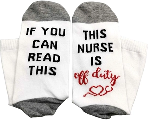 Detailed knit texture of white nurse socks with IF YOU CAN READ THIS off duty text
