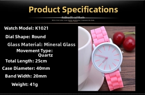Detailed view of pink silicone strap and white round dial of this quartz watch