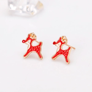 Macro view of gold-plated reindeer stud earrings with red enamel and rhinestone details
