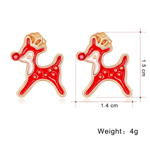 Detailed view of red reindeer earrings with gold trim, rhinestones, and size measurements