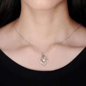 S925 sterling silver heartbeat necklace with sparkling cubic zirconia on a female model
