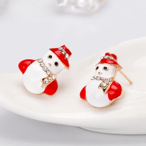 Macro detail of snowman earrings with red and white enamel plus sparkling rhinestones