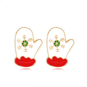 Detailed close-up of festive Christmas glove earrings with red enamel and golden snowflake