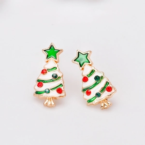 Close-up of festive Christmas tree stud earrings with gold edges and colorful rhinestones