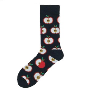 Detailed close-up of black cotton crew socks featuring red sliced apple patterns