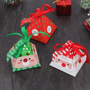 Christmas pyramid gift boxes with festive reindeer and Santa patterns on wood background