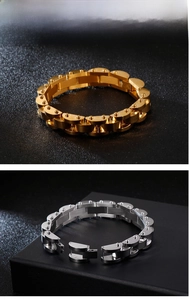 Detailed close-up of gold and silver steel bracelets with textured rhombus links