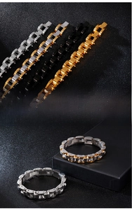 Detailed view of industrial style steel link bracelets in silver, gold, and black finishes