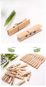 Detailed view of bamboo clothespins with durable metal springs and natural wood texture