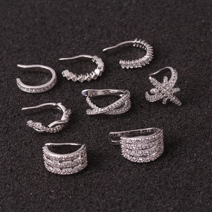 Set of eight silver zircon ear cuffs with various U-shaped minimalist designs