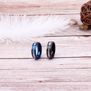 Two-tone stainless steel couple rings in navy blue and black with diamond accents