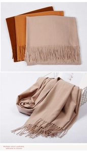 Detailed view of soft cashmere-feel scarf with elegant long tassels in various colors