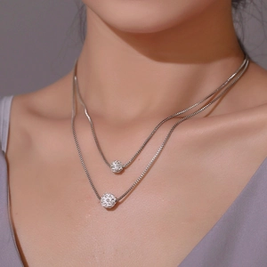 Minimalist double layer silver necklace with shimmering crystal disco ball pendants