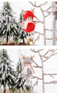Detailed plush Christmas girl ornament featuring reindeer antlers and star snowflake charms